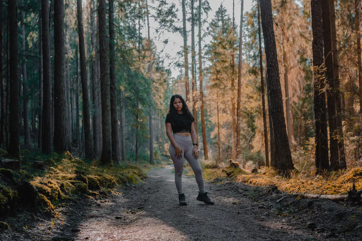 A woman walking outdoors in fresh morning light
