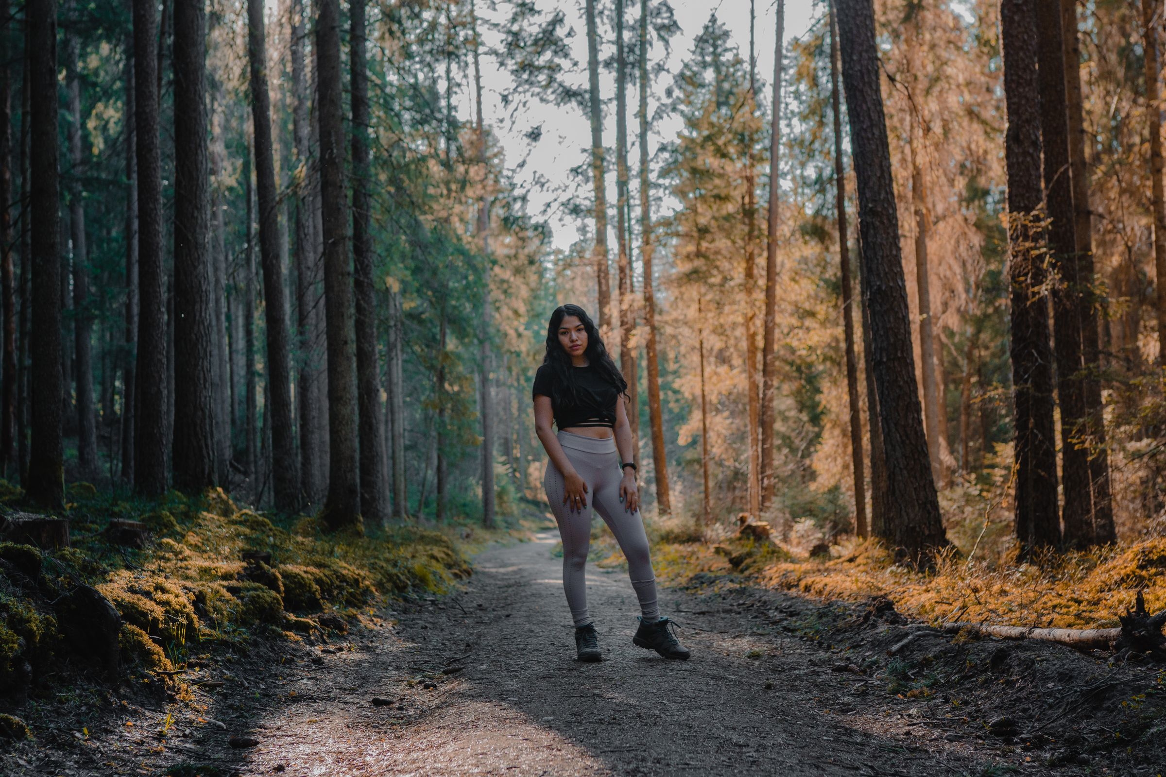 A woman walking outdoors in fresh morning light